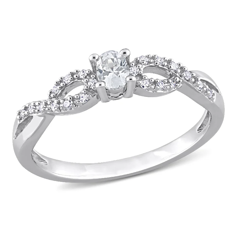 Miadora 1/4ct TGW Created White Sapphire and 1/10ct TW Diamond Infinity Engagement Ring in Sterling Silver