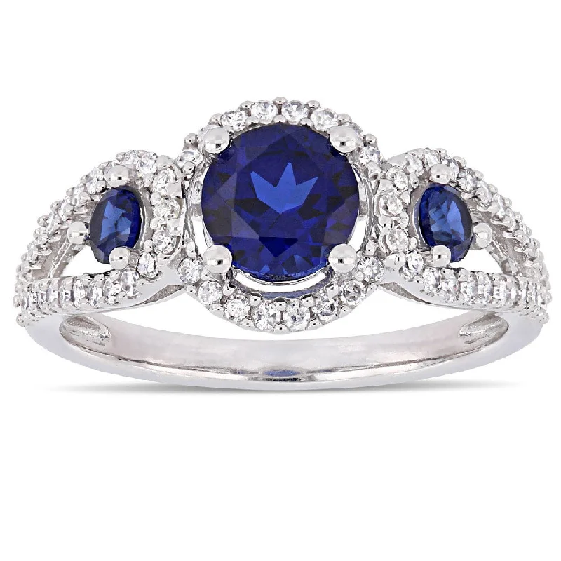 Miadora Signature Collection 10k White Gold Created Blue Sapphire and 1/3ct TDW Diamond 3-Stone Halo Crossover Engagement Ring