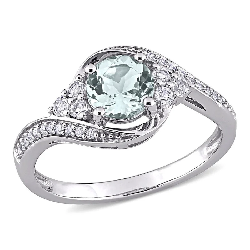 Miadora 10k White Gold Aquamarine, White Topaz and 1/10ct TDW Diamond Bypass Engagement Ring